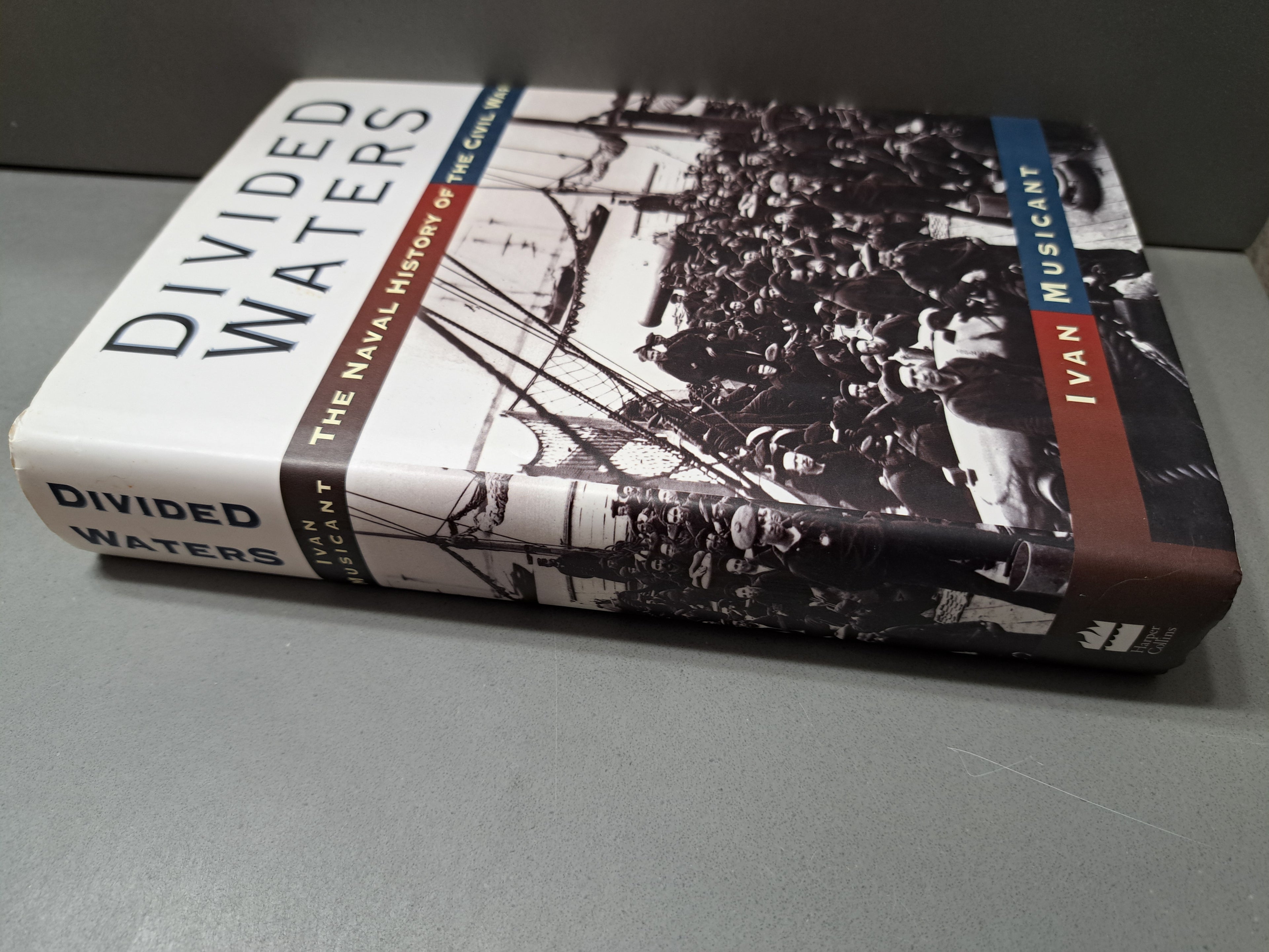 1995 first edition of Divided Waters: The Naval History of the Civil War by Ivan Musicant