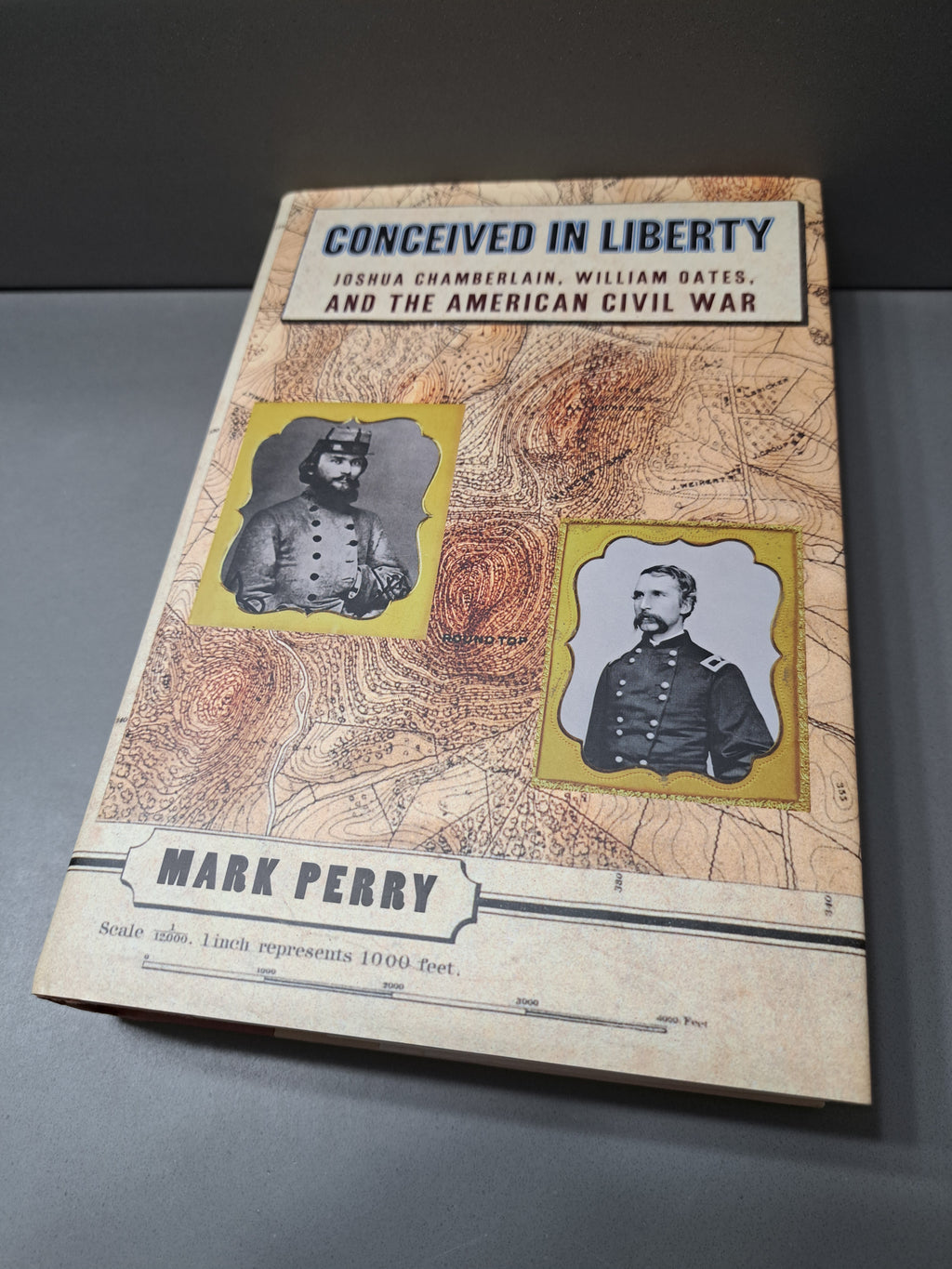 1997 first edition of Conceived in Liberty by Mark Perry